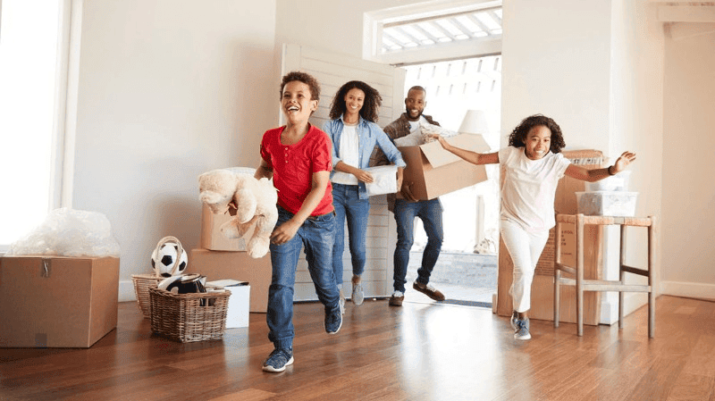 A family happily moving to their new home in Boxboro, MA.