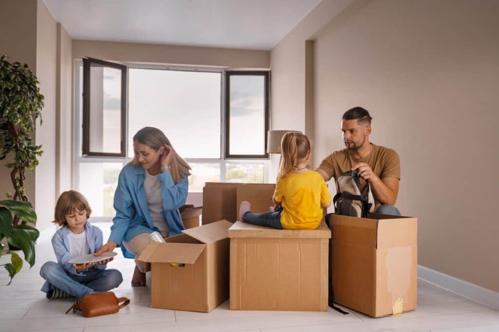 happy-family-with-kids-moving-their-new-home